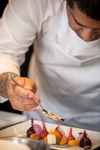 A Starr Catering chef adds the finishing touches. Photo by Steve Legado