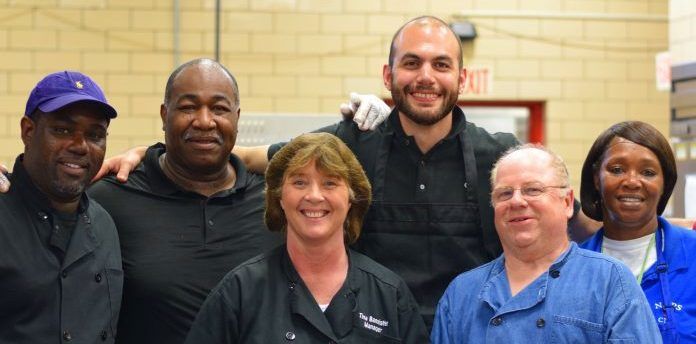 Daniel Giusti with cafeteria staff workers