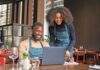 inflation impact restaurant managers working with laptop