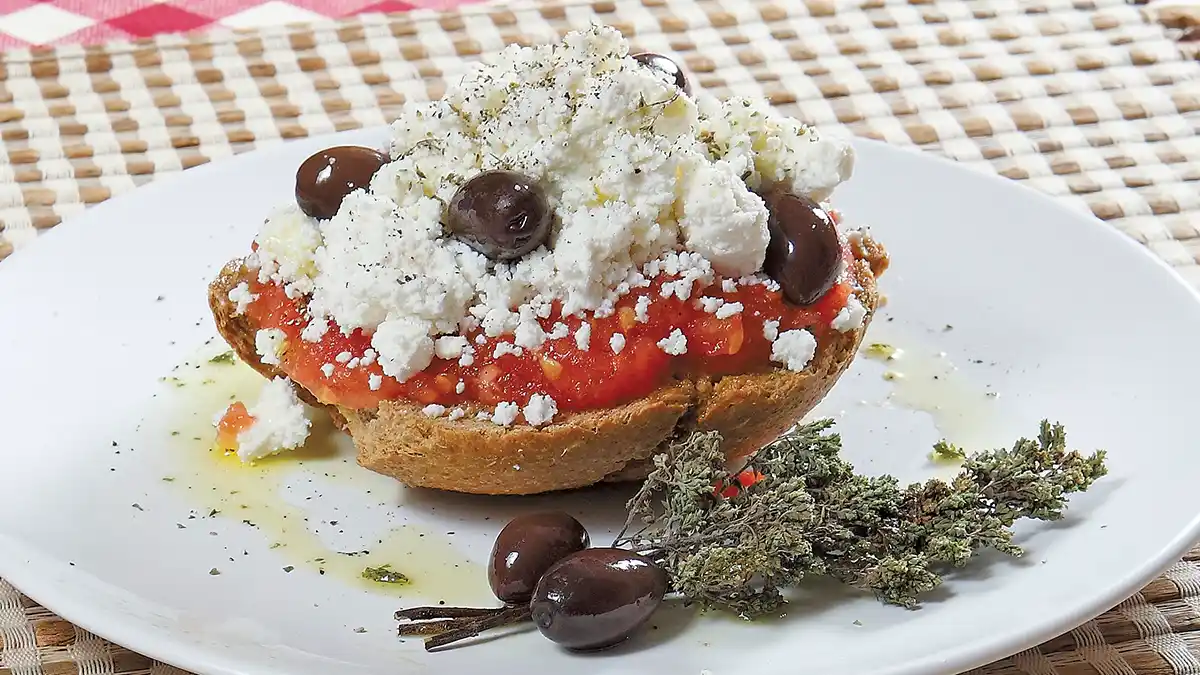 Traditional Dakosalata Barley Rusk Salad with Tomato Feta Olives and Greek Oregano